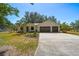 Beautiful home with a well-maintained lawn and a spacious two-car garage at 18902 Spring Hollow Dr, Lutz, FL 33559