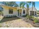 Close up front exterior shot of a well-manicured lawn and a convenient two-car garage at 18902 Spring Hollow Dr, Lutz, FL 33559