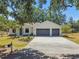 Well maintained lawn and landscaping enhances the curb appeal of this attractive home at 18902 Spring Hollow Dr, Lutz, FL 33559