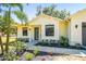Inviting single-story home featuring fresh landscaping and a charming entryway at 18902 Spring Hollow Dr, Lutz, FL 33559