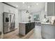 Modern kitchen with an island, stainless steel appliances, and natural lighting at 18902 Spring Hollow Dr, Lutz, FL 33559