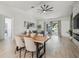 Bright living room with a modern fireplace, hardwood floors, and patio access at 18902 Spring Hollow Dr, Lutz, FL 33559