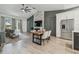 Bright living room featuring vaulted ceilings, hardwood floors, and a modern fireplace at 18902 Spring Hollow Dr, Lutz, FL 33559