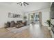 Spacious living room features a comfortable sectional sofa, natural light, and open layout at 18902 Spring Hollow Dr, Lutz, FL 33559