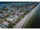Aerial shot along the coast with condos, beach access, sandy shoreline, and waterfront views at 1912 Gulf Blvd # 305, Indian Rocks Beach, FL 33785
