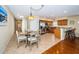 Bright dining area with a skylight, adjacent to the kitchen, creating a welcoming atmosphere at 1912 Gulf Blvd # 305, Indian Rocks Beach, FL 33785