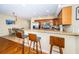 Well-equipped kitchen with a breakfast bar, stainless steel appliances, and ample cabinet space at 1912 Gulf Blvd # 305, Indian Rocks Beach, FL 33785