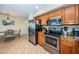 Kitchen with stainless steel appliances, countertops and a cozy dining area perfect for everyday meals and entertaining at 1912 Gulf Blvd # 305, Indian Rocks Beach, FL 33785