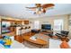 Open-concept living space with sleek furniture, hardwood floors, and access to the kitchen area at 1912 Gulf Blvd # 305, Indian Rocks Beach, FL 33785