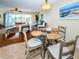 Inviting view of the living room from the dining area showcasing an open floor plan and a bright, airy feel at 1912 Gulf Blvd # 305, Indian Rocks Beach, FL 33785