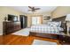 Comfortable bedroom with ample natural light, hardwood floors, and tasteful decor at 1912 Gulf Blvd # 305, Indian Rocks Beach, FL 33785