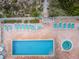 Aerial shot of pool area featuring pool and hot tub, surrounded by chairs at 1912 Gulf Blvd # 305, Indian Rocks Beach, FL 33785