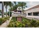 Attractive entryway sign with the name 'Oceanway' displayed among lush greenery and tropical palm trees at 1912 Gulf Blvd # 305, Indian Rocks Beach, FL 33785