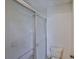 Bathroom with a tiled shower stall and toilet at 1915 W Del Webb Blvd, Sun City Center, FL 33573