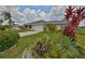 Well-maintained one-story home with vibrant landscaping and a spacious driveway at 1915 W Del Webb Blvd, Sun City Center, FL 33573