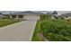 Charming single-story home with an attached garage and tidy landscaping at 1915 W Del Webb Blvd, Sun City Center, FL 33573