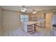 Bright kitchen boasts an island with shelving and tons of cabinets at 1915 W Del Webb Blvd, Sun City Center, FL 33573