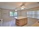 Bright kitchen with an island, tile floors and lots of natural light at 1915 W Del Webb Blvd, Sun City Center, FL 33573