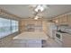 Spacious kitchen with an island, cabinets and white appliances at 1915 W Del Webb Blvd, Sun City Center, FL 33573
