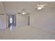 Spacious living room featuring vaulted ceilings, tile flooring, and ample natural light at 1915 W Del Webb Blvd, Sun City Center, FL 33573