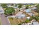 Aerial view of a well-maintained property with a landscaped yard and a long driveway at 200 Lewis Se Blvd, St Petersburg, FL 33705