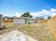 View of a spacious backyard enclosed with a wooden fence at 200 Lewis Se Blvd, St Petersburg, FL 33705