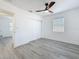 Bedroom features a ceiling fan, window and closet for plenty of storage at 200 Lewis Se Blvd, St Petersburg, FL 33705