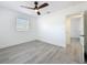 Bedroom featuring gray wood-look floors and a view into another room at 200 Lewis Se Blvd, St Petersburg, FL 33705