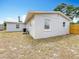 Backyard view of an exterior, with tidy landscaping and an outdoor air conditioning unit at 200 Lewis Se Blvd, St Petersburg, FL 33705