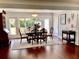 Formal dining room with large windows and a decorative light fixture at 209 Rosery Rd, Belleair, FL 33756