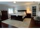Comfortable bedroom with hardwood floors, ample natural light, and a cozy atmosphere at 209 Rosery Rd, Belleair, FL 33756