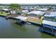 Aerial view of a canal front home featuring a boat lift at 210 N Saint Thomas Cir, Apollo Beach, FL 33572