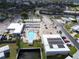 Aerial view of a community center with a pool, parking, and amenities for residents at 210 N Saint Thomas Cir, Apollo Beach, FL 33572