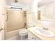 Bathroom featuring sink, vanity, toilet and shower/tub combo at 210 N Saint Thomas Cir, Apollo Beach, FL 33572