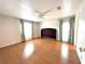 Bright bedroom with hardwood floors and two bright windows at 210 N Saint Thomas Cir, Apollo Beach, FL 33572