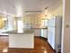 Kitchen featuring white cabinets, center island and matching appliances at 210 N Saint Thomas Cir, Apollo Beach, FL 33572