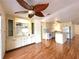 Open kitchen featuring wood floors, center island and built in cabinets at 210 N Saint Thomas Cir, Apollo Beach, FL 33572