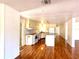 Bright kitchen featuring wood floors, center island, and white cabinets at 210 N Saint Thomas Cir, Apollo Beach, FL 33572
