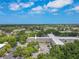 An aerial view displays beautiful exterior and surrounding lush landscaping at 2436 Rhodesian Dr # 24, Clearwater, FL 33763