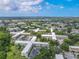 The aerial view shows the beautiful building and surroundings at 2436 Rhodesian Dr # 24, Clearwater, FL 33763