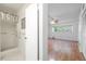 Bathroom and bedroom feature hardwood and tile floors and natural lighting at 2436 Rhodesian Dr # 24, Clearwater, FL 33763