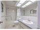 Bathroom features a tub/shower combo, a single vanity, a medicine cabinet, and neutral colors at 2436 Rhodesian Dr # 24, Clearwater, FL 33763