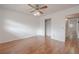 Bedroom with hardwood floors, ceiling fan, closet, and a neutral color palette at 2436 Rhodesian Dr # 24, Clearwater, FL 33763