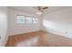 Bedroom with hardwood floors and a window offering natural light at 2436 Rhodesian Dr # 24, Clearwater, FL 33763