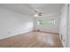 Bright bedroom features hardwood floors and a window overlooking the landscape at 2436 Rhodesian Dr # 24, Clearwater, FL 33763