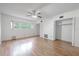 Bedroom offers hardwood floors, a ceiling fan, and an ample closet for storage at 2436 Rhodesian Dr # 24, Clearwater, FL 33763