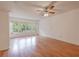 Hardwood floors, natural lighting, and a ceiling fan highlight this traditional living room at 2436 Rhodesian Dr # 24, Clearwater, FL 33763