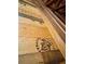 Spacious attic with wooden beams and floor with logos at 2714 W Jetton Ave, Tampa, FL 33629