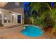 Beautiful backyard with a pool, patio, tropical plants and a tranquil atmosphere provides a perfect outdoor escape at 2714 W Jetton Ave, Tampa, FL 33629