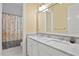 Bright bathroom with marble countertops, double vanity, and brushed nickel fixtures at 2714 W Jetton Ave, Tampa, FL 33629